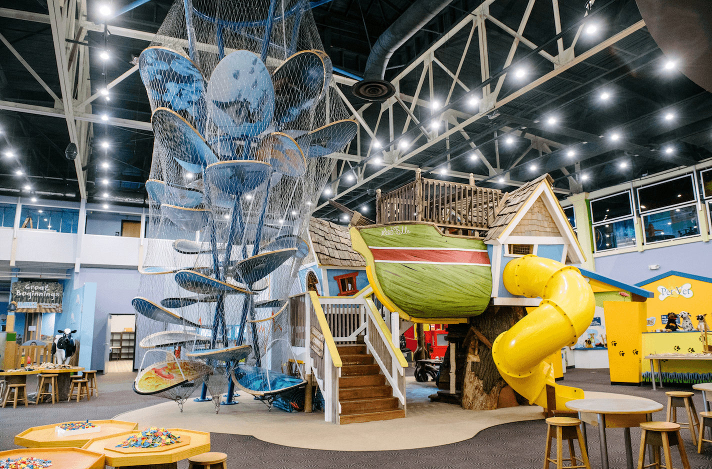 a playground with a yellow slide