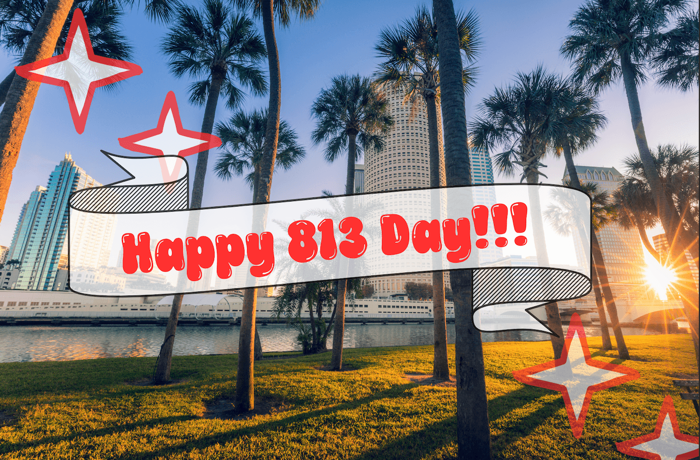 813 in red in front of the city of tampa at the riverwalk