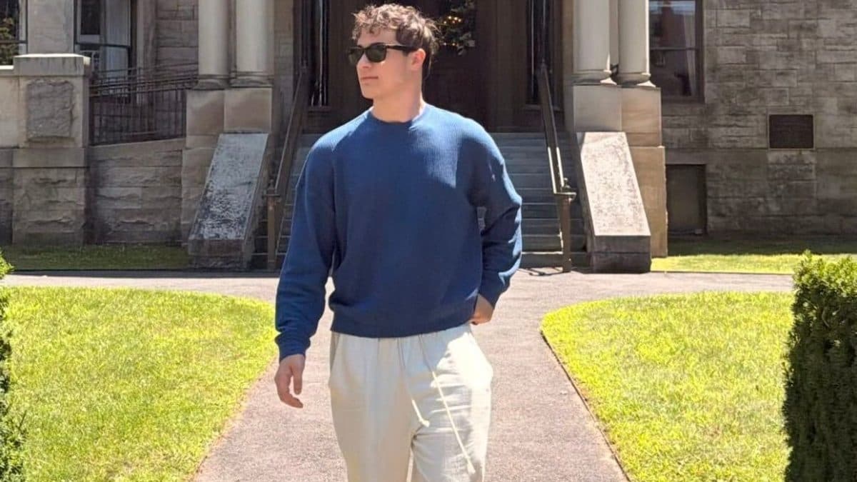 Ryan Shatzkamer, Director of Technical Services at outboundIQ, walking outside a historic stone building