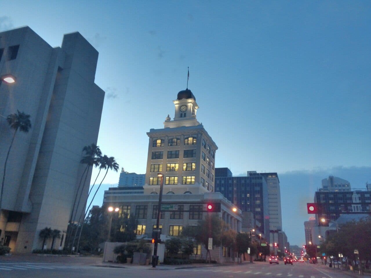 Tampa City Hall's clock tower lit up at dusk on Kennedy Boulevard in downtown Tampa