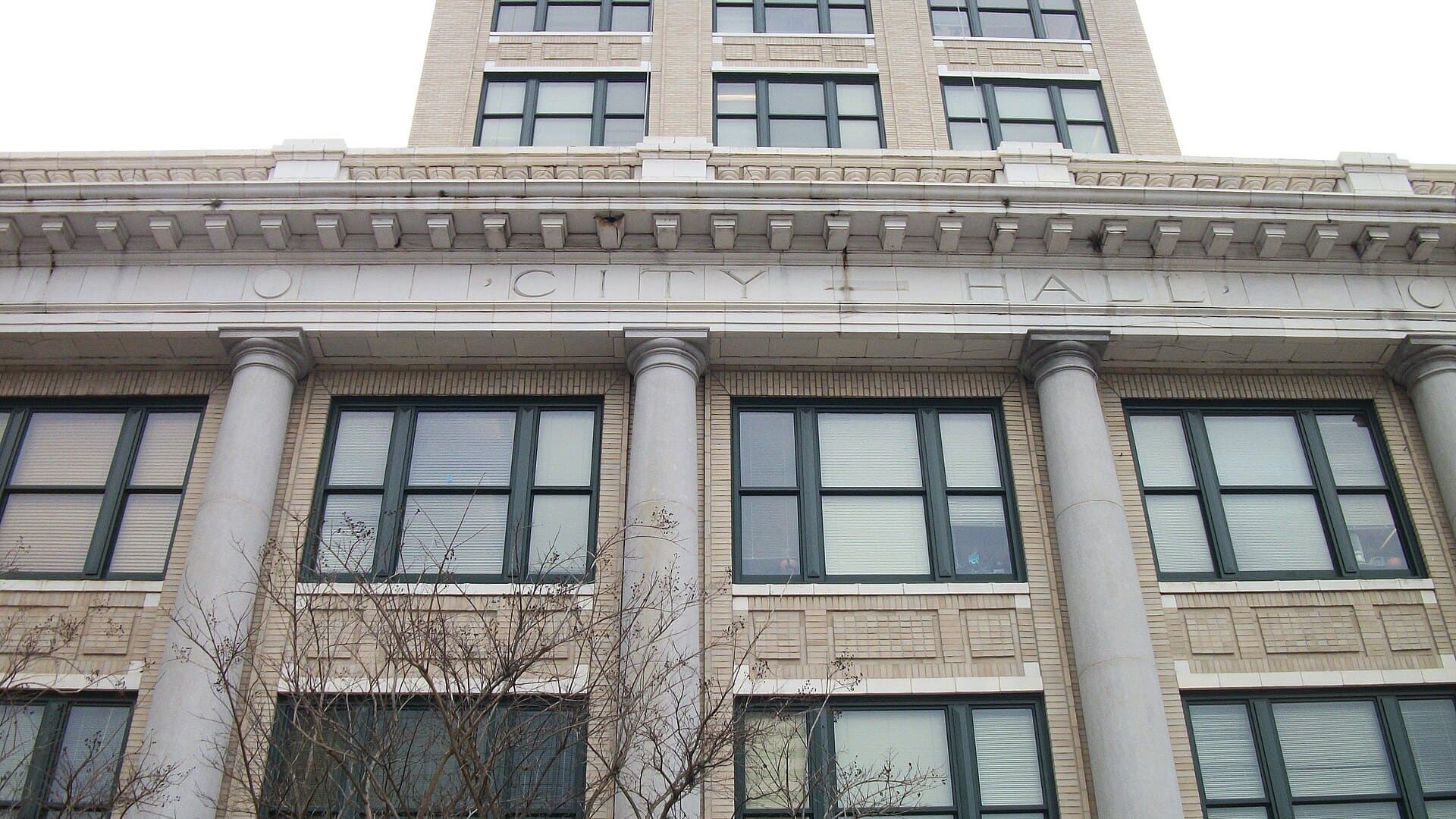 Facade of Tampa's Old City Hall with CITY HALL carved above its columns
